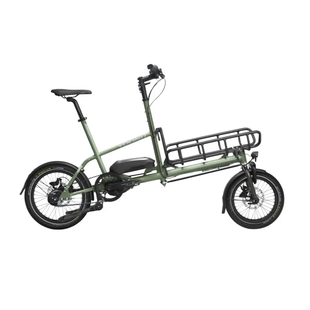 Green electric cargo bike with a long rear rack for hauling cargo, two wheels, and a central motor enclosure under the seat area.